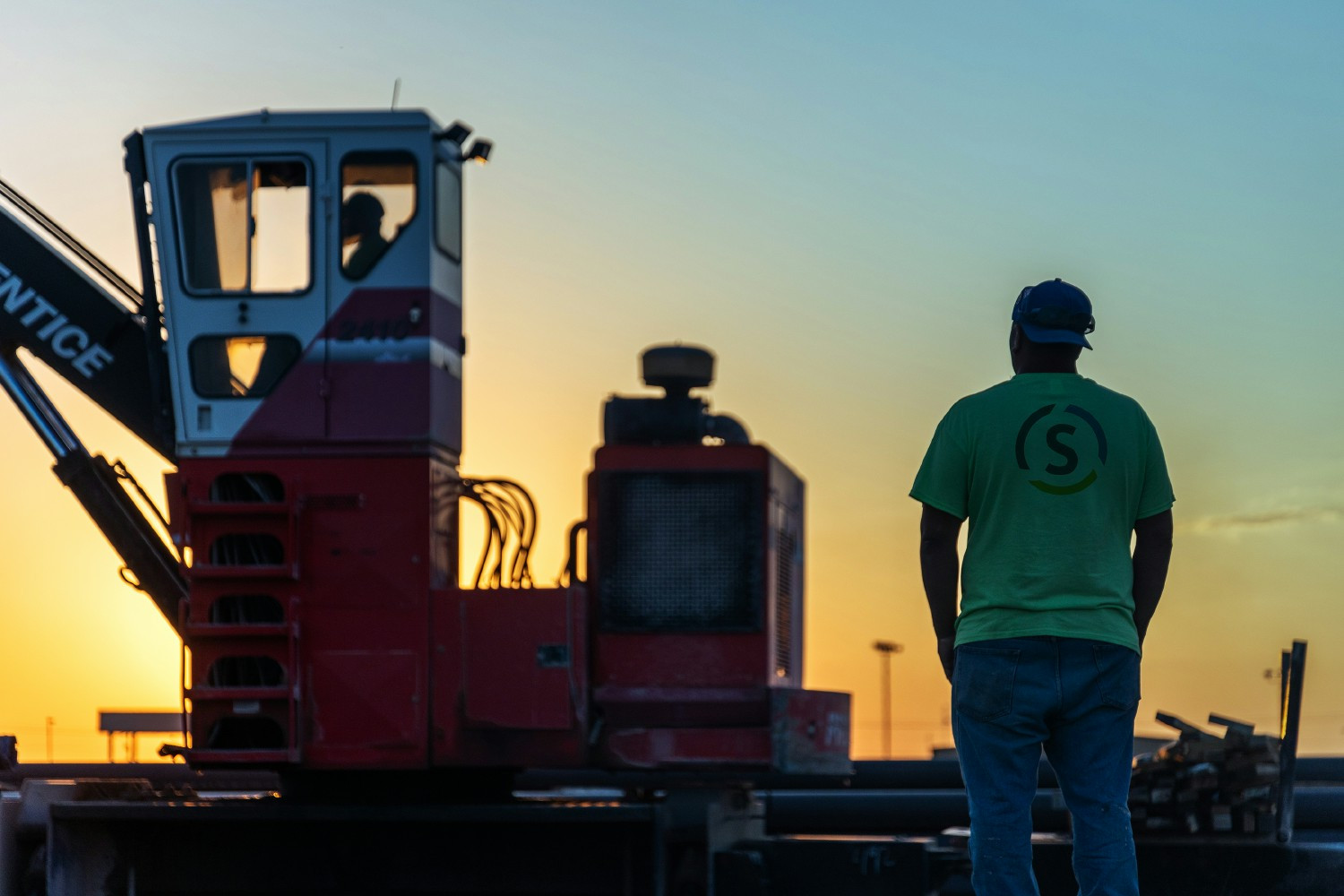 At sunset, a dedicated Sooner team member oversees the pipe yard. 