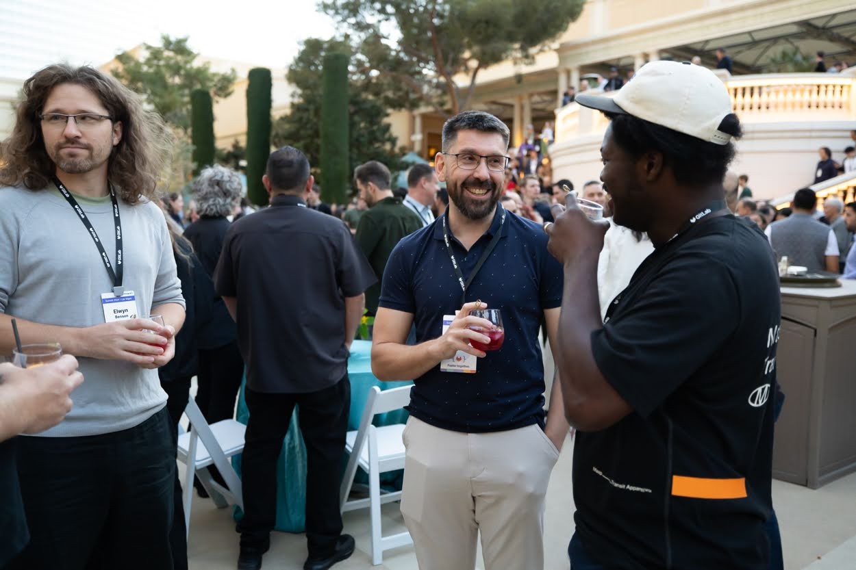 Team members sharing a laugh at a GitLab hosted happy hour